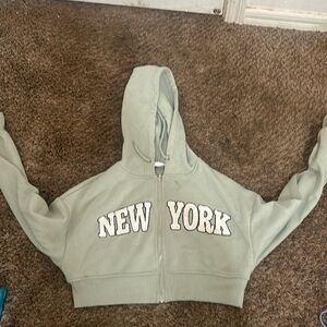 A New York sage green zip up jacket